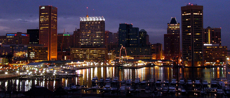Baltimore skyscrapers at night from across the water