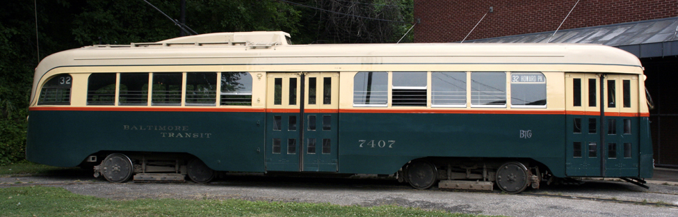 A historic Baltimore streetcar painted green and red